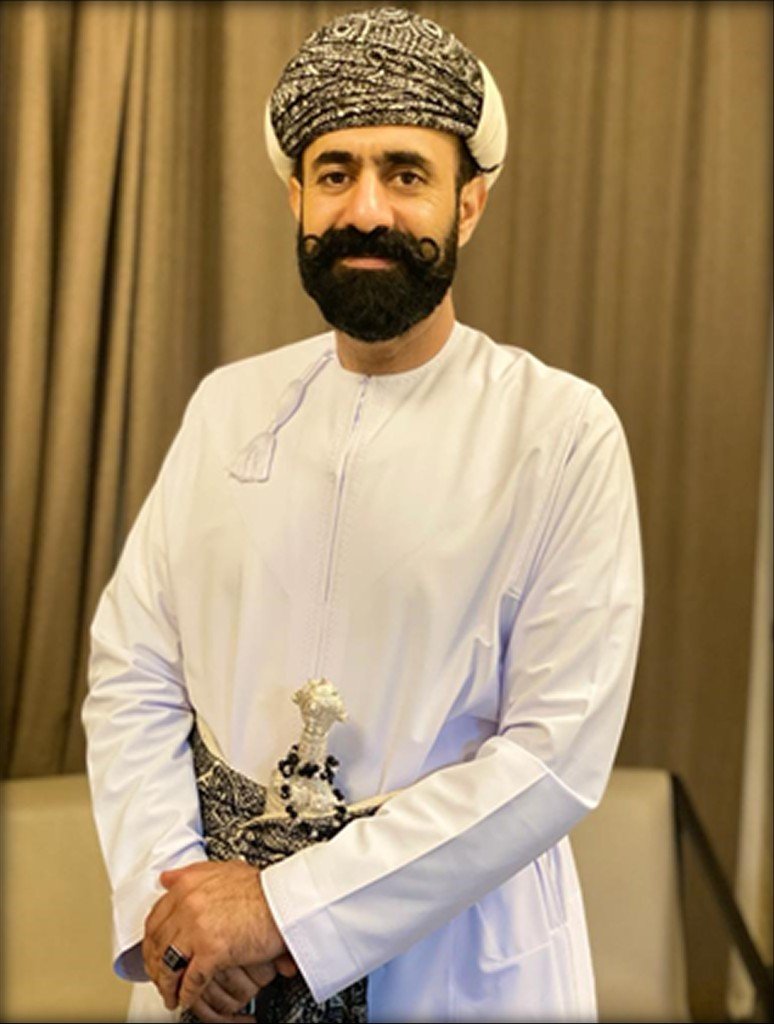 Professional portrait of Said Ibrahim Al Bulushi, Managing Director, wearing traditional Omani attire including a white dishdasha and khanjar.
